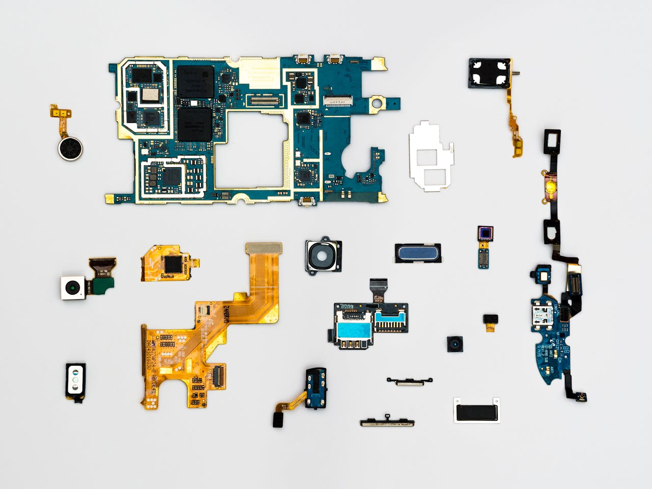 services-01 Exploded view of smartphone components showcasing intricate technological design.